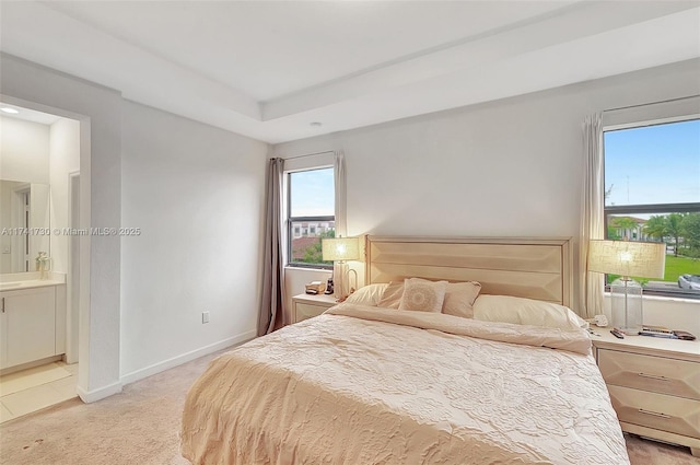 bedroom featuring carpet flooring and ensuite bath