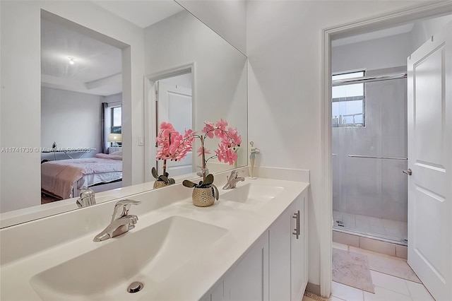 bathroom featuring vanity, an enclosed shower, and tile patterned floors