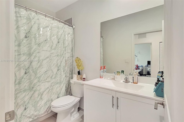 bathroom featuring vanity, a shower with curtain, and toilet