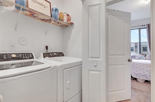 washroom featuring carpet and washing machine and clothes dryer