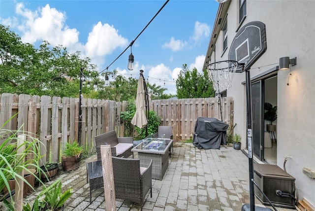 view of patio / terrace featuring grilling area and an outdoor fire pit