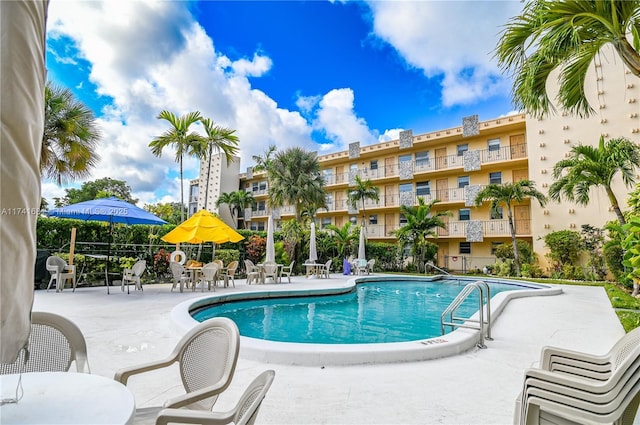 view of swimming pool featuring a patio