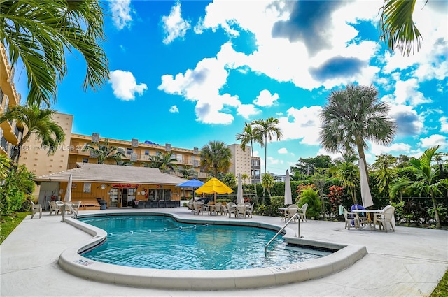 view of swimming pool with a patio area