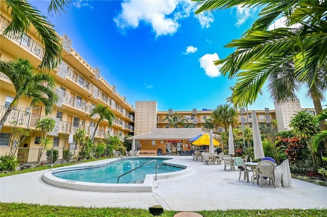 view of swimming pool with a patio