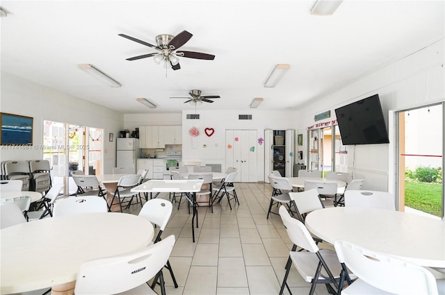 tiled dining room with ceiling fan