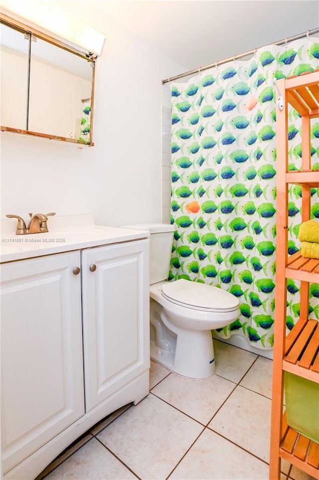 bathroom featuring vanity, tile patterned floors, toilet, and a shower with shower curtain