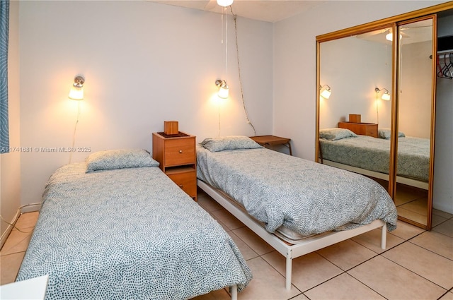 bedroom featuring a closet and light tile patterned floors