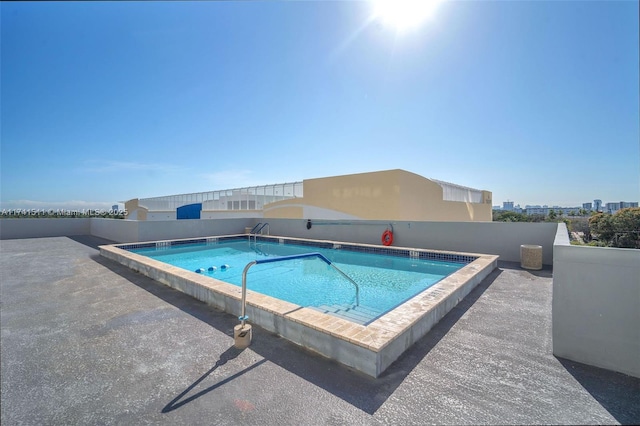 view of swimming pool with a patio area