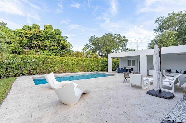 view of swimming pool featuring a patio area