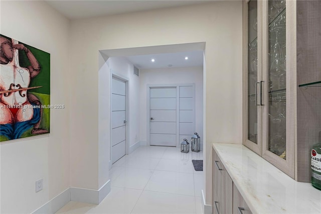 bathroom with tile patterned floors and vanity