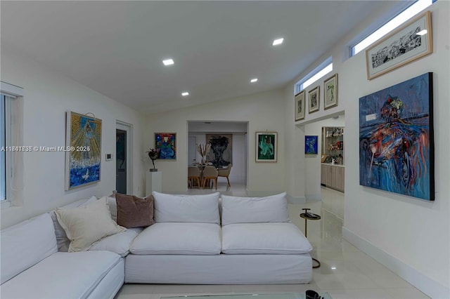 living room featuring vaulted ceiling