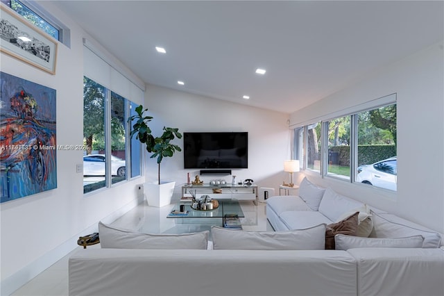 living room featuring lofted ceiling