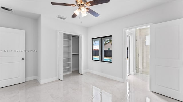 bedroom with a closet, ceiling fan, and ensuite bathroom