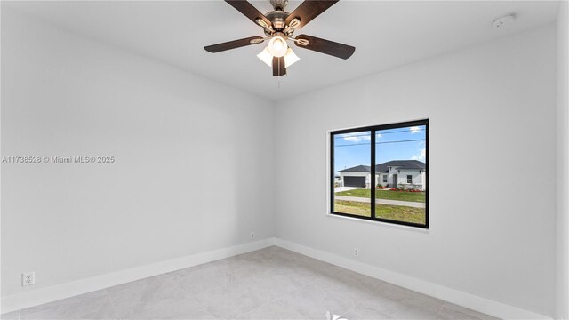 spare room featuring ceiling fan