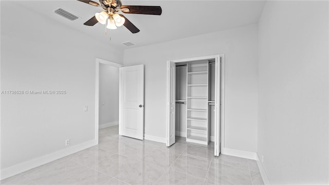 unfurnished bedroom featuring a closet and ceiling fan