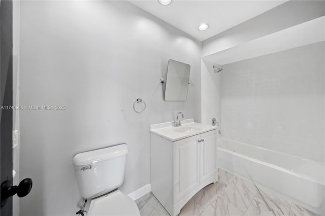 full bathroom featuring vanity, tiled shower / bath, and toilet