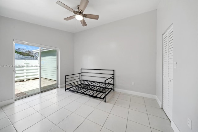 tiled bedroom featuring access to exterior and ceiling fan