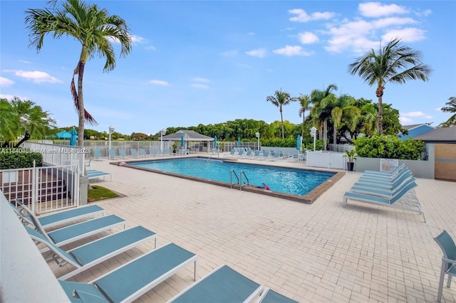 view of swimming pool featuring a patio area