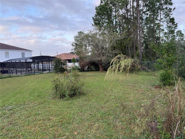 view of yard featuring a lanai