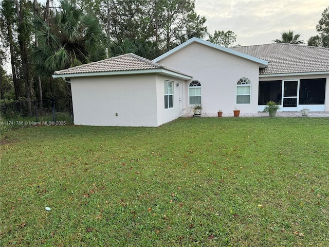 view of property exterior featuring a yard