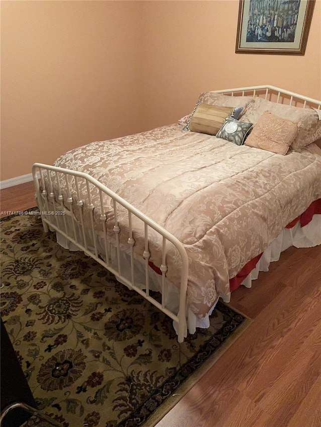 bedroom featuring wood-type flooring