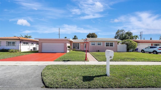 single story home featuring a garage, a front yard, and central AC unit