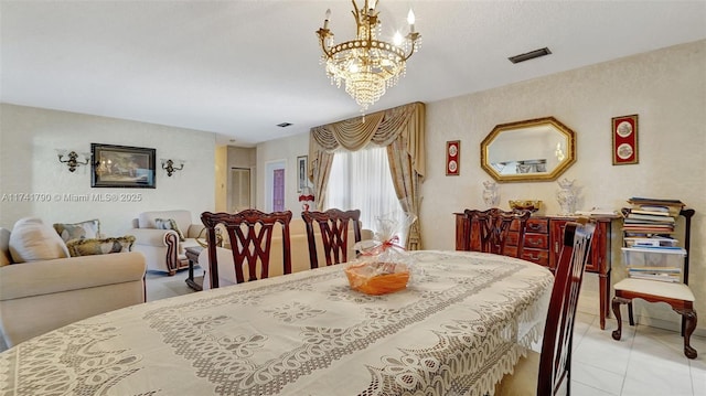 dining area featuring a notable chandelier