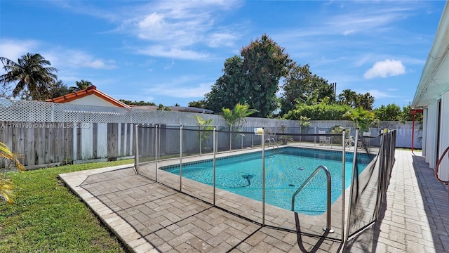 view of swimming pool with a patio