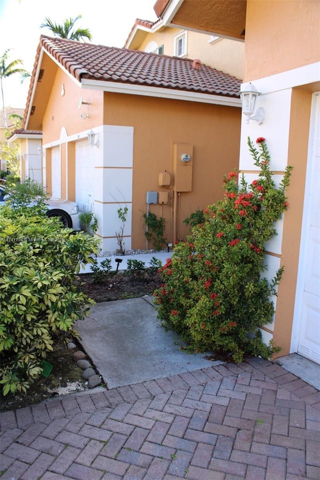 view of property exterior with a garage