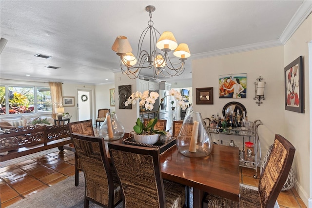 dining room with crown molding and an inviting chandelier