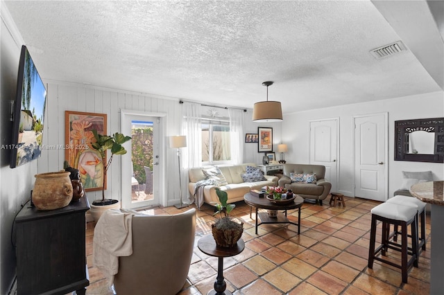 living room with a textured ceiling