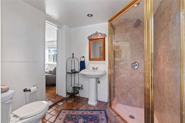 bathroom featuring an enclosed shower, tile patterned flooring, and toilet