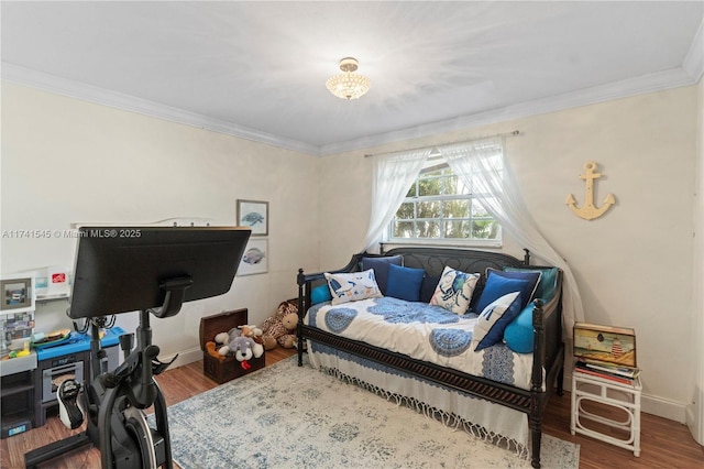 bedroom with hardwood / wood-style flooring and ornamental molding