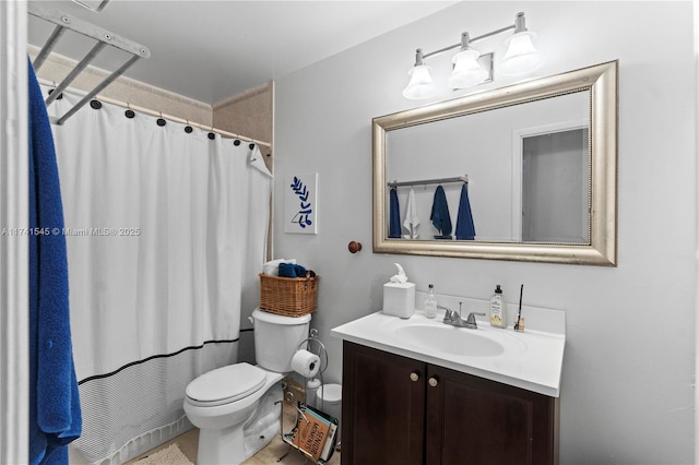 bathroom with vanity, toilet, and walk in shower