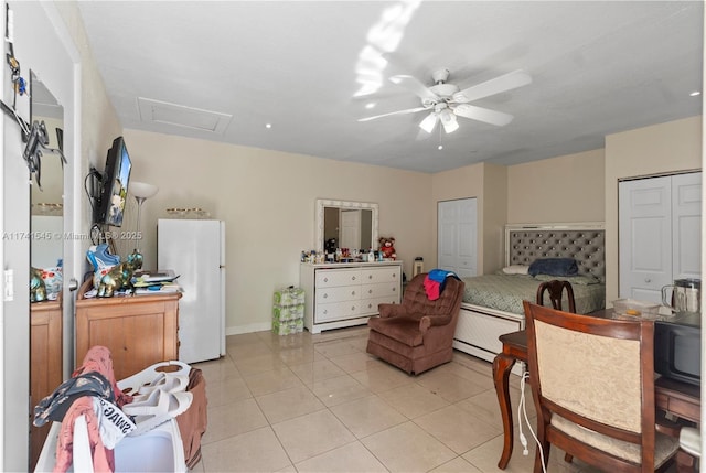 living room with ceiling fan and light tile patterned flooring