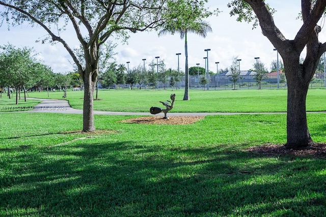 surrounding community featuring a yard