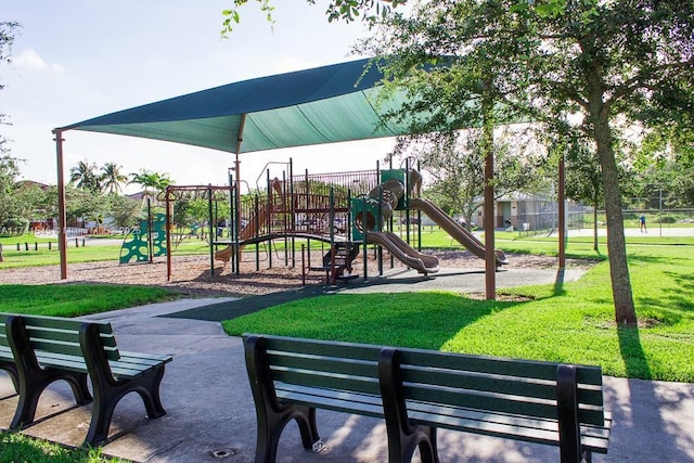 view of playground with a lawn