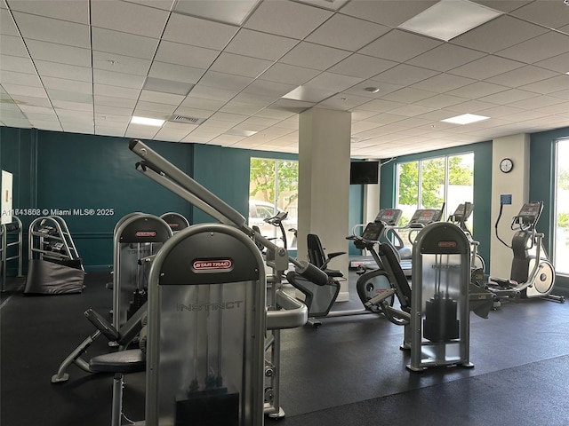 gym featuring a paneled ceiling