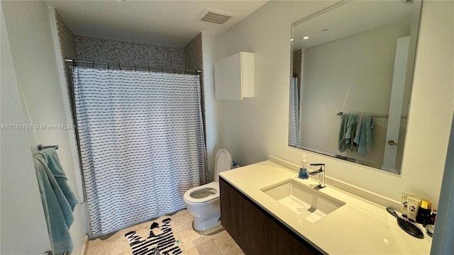 bathroom featuring vanity, toilet, and walk in shower