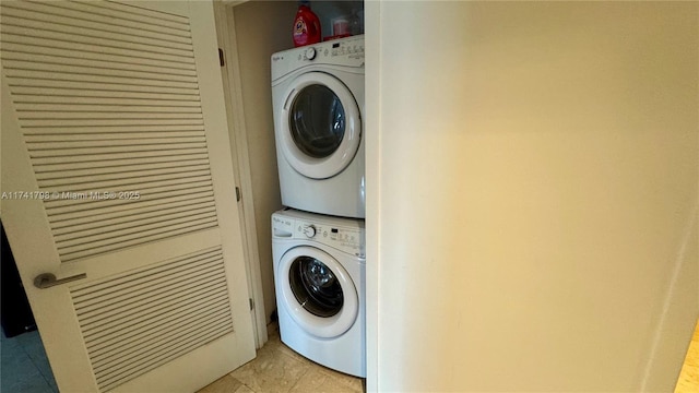 laundry room with stacked washing maching and dryer