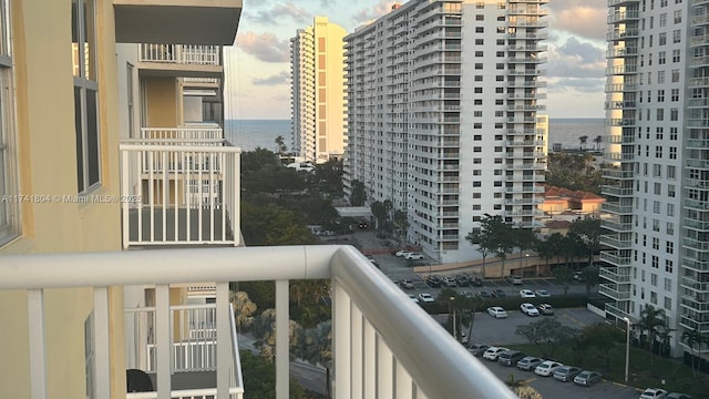 balcony featuring a water view