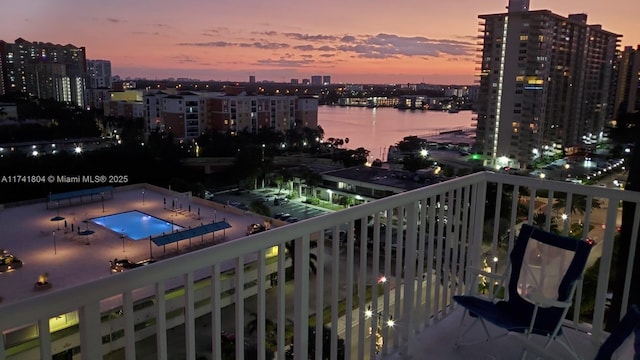 balcony at dusk with a water view