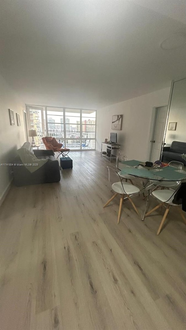 interior space with light hardwood / wood-style flooring and expansive windows