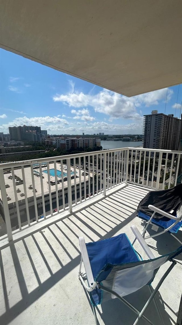 balcony featuring a water view