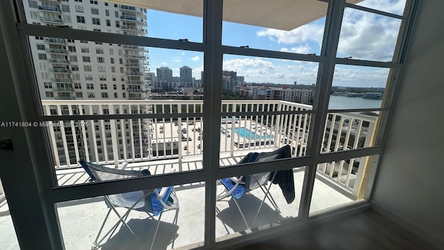 balcony featuring a water view