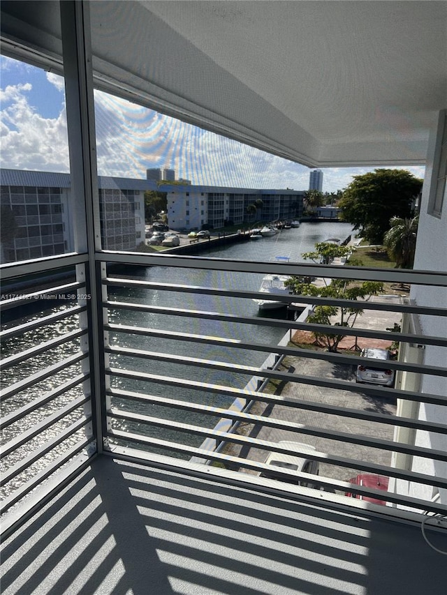 exterior space featuring a water view and a view of city