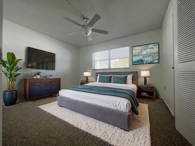 bedroom featuring a closet, carpet, a ceiling fan, and a textured ceiling