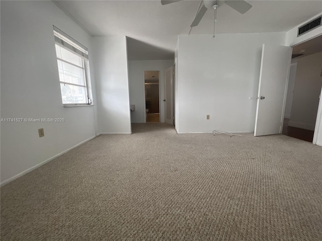 unfurnished bedroom with light carpet, visible vents, baseboards, and ceiling fan