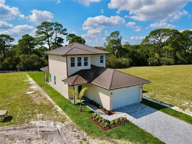view of front facade featuring a garage and a front yard