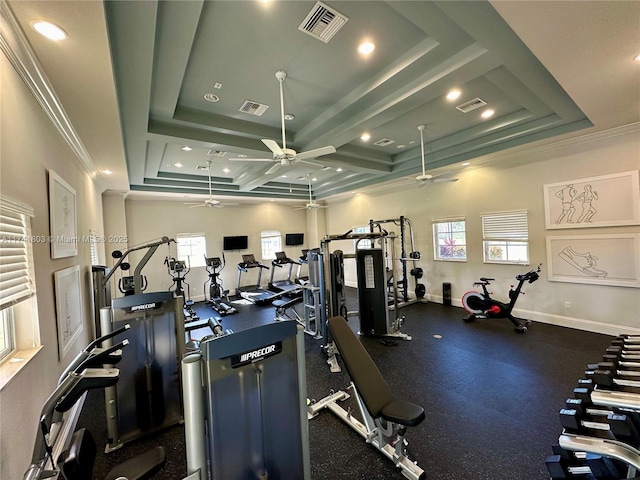 gym featuring a raised ceiling, crown molding, and coffered ceiling